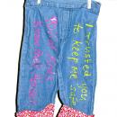 To raise awareness, Brown County Victim/Witness Assistance Program displays jeans decorated with messages from sexual assault survivors