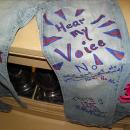 Jeans decorated with messages of resilience, strength and hope by survivors of sexual violence, part of â€œDenim Dayâ€ observance