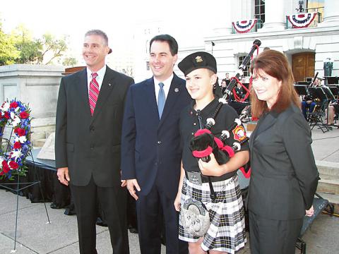 AG J.B. Van Hollen with Gov. Scott Walker, Lt. Gov. Rebecca Kleefisch and 13-year-old Tyler Tuttle, who played the bagpipes as part of the Sheboygan County Sheriffâ€™s Department Honor Guard with which his dad serves.