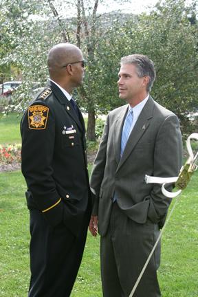 Attorney General J.B. Van Hollen talks with Milwaukee County Sheriff David Clarke Jr. before the National Day of Remembrance for Murder Victims Ceremony 2010 in Watertown, Wisconsin. 