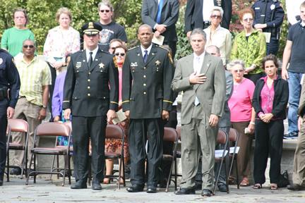Attorney General J.B. Van Hollen stands with Milwaukee County Sheriff, David Clarke Jr., during the retiring of the colors at the National Day of Remembrance for Murder Victims Ceremony 2010 in Watertown, WI.